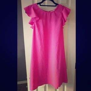Bright pink dress with ruffled shoulder
